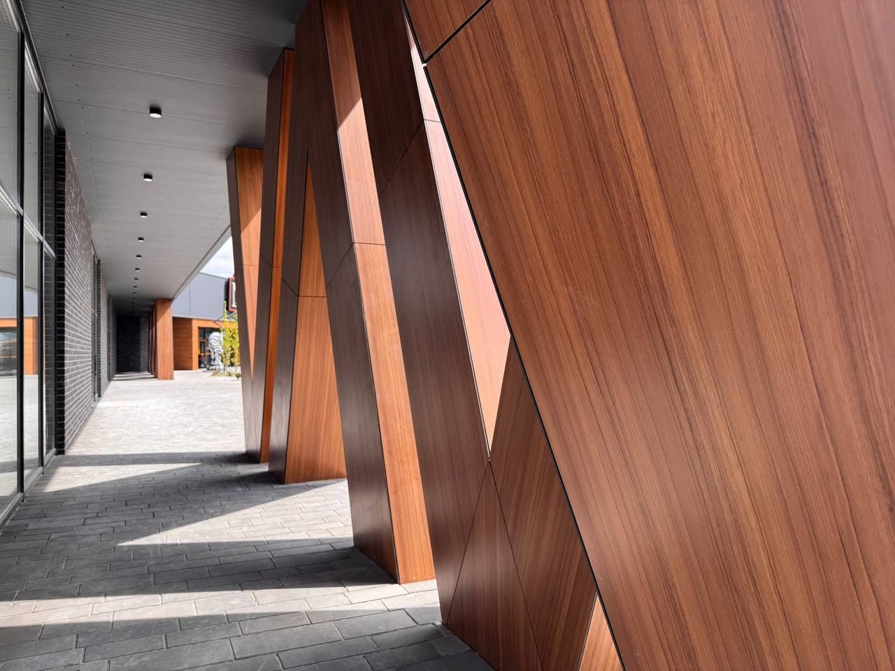 Colonnade clad in timber-effect exterior HPL panels